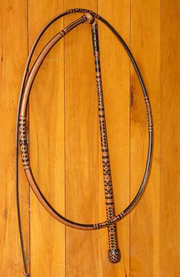 Sydney whip 06.JPG - A 24 x 24 plait Australian stock whip made by Chris Barr placed "1st" in its class at  Sydney Royal Easter Show 2006. Also receiving a "Standard of Excellence Award"  Some unique original patterns in this piece. "FOR SALE"